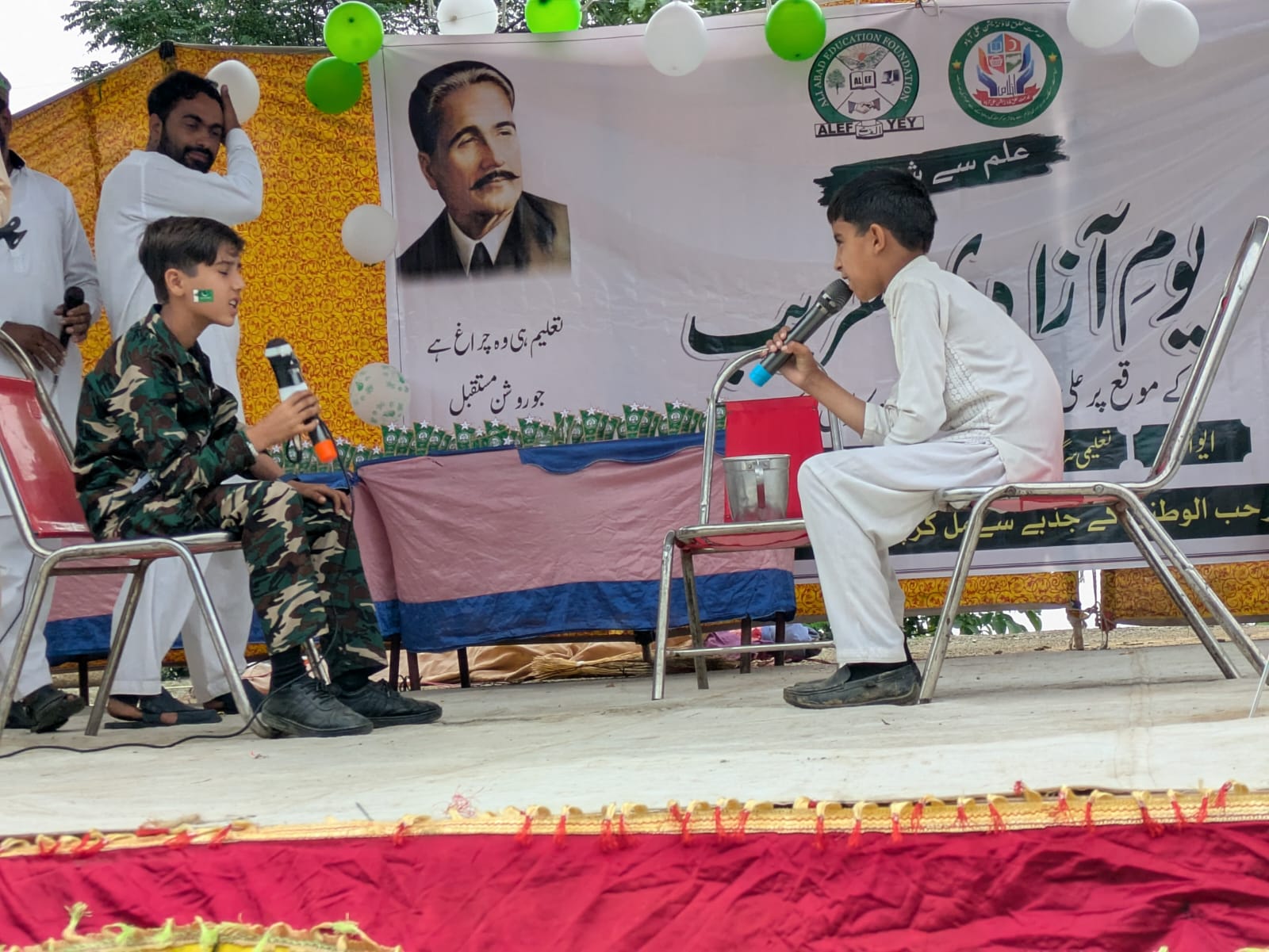 Two boys sharing a skit in front of the crowd
